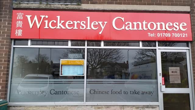 Bright red sign with "Wickersley Cantonese" and "Chinese food to take away" displayed prominently on a restaurant window.