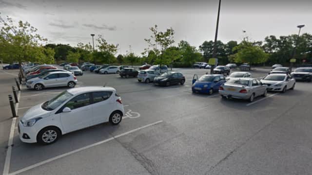 Pay & Display parking area in Hessle, Yorkshire, featuring various parked cars and trees in the background.