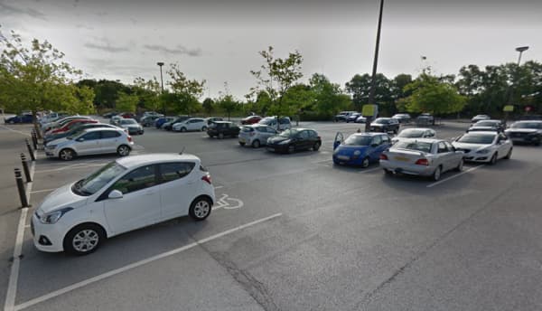 Pay & Display parking area in Hessle, Yorkshire, featuring various parked cars and trees in the background.