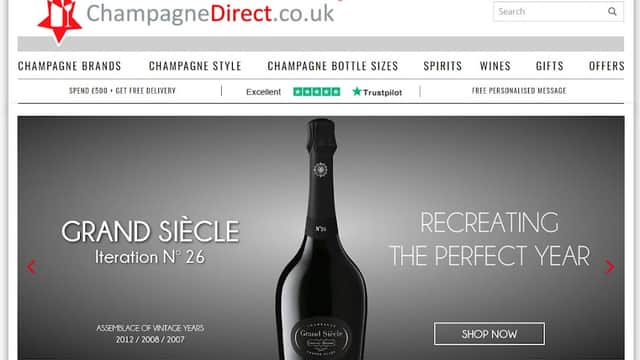 Champagne Direct Ltd website featuring a bottle of Grand Siècle champagne and navigation for products and services.