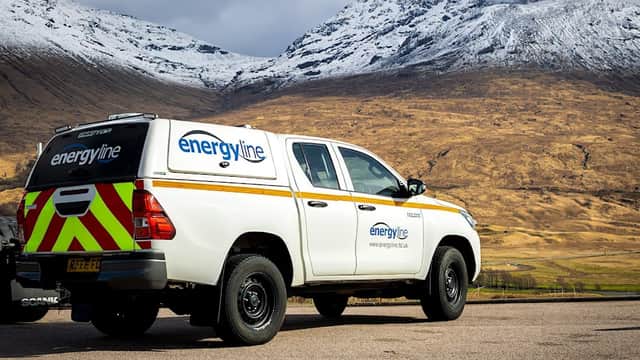 Energyline Limited truck parked with snow-capped mountains and a golden landscape in the background.