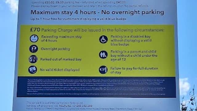Sign detailing parking regulations and fees at Co-operative Private Car Park in Whitby, Yorkshire.
