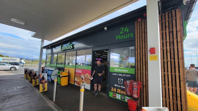 Exelby Services shop with a modern facade, open 24 hours, featuring food signage and a welcoming entrance.