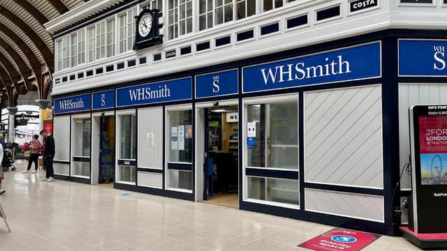 WHSmith shop front in Starbeck, Yorkshire, featuring large windows, blue signage, and a clock above the entrance.