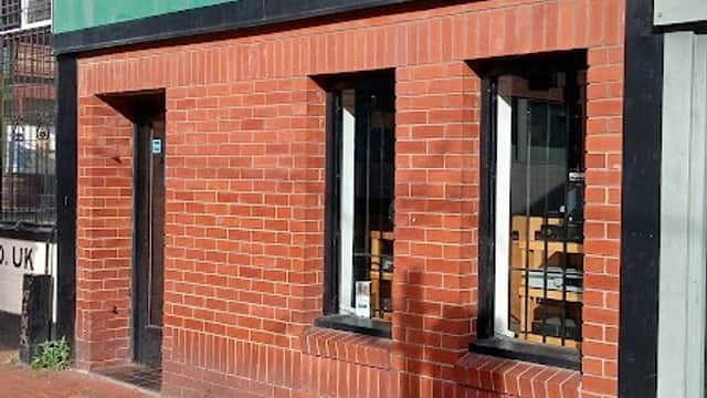 Green storefront with the text "audio images," red brick facade, and two large windows in Sheffield, Yorkshire.
