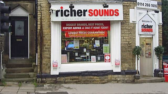 Richer Sounds storefront in Sheffield with large windows displaying home audio equipment and promotional signage.