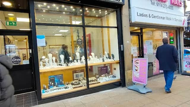 Jewellery shop window displaying various pieces, with "Morris Bywater Ltd" and "Family Jewellers" signage.