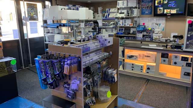 Interior of Fit Filtration pet shop, featuring shelves stocked with various pet supplies and equipment.