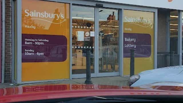 Sainsbury's store entrance in Haxby, Yorkshire, featuring signage for bakery and lottery services.