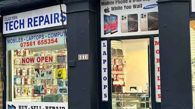 Shopfront of Clayton Tech Repairs featuring signs for mobile, laptop, and iPad repairs, with a welcoming open door.