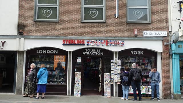 Sterling Souvenirs shopfront in York, featuring colorful displays and visitors browsing outside.