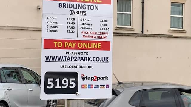 Pay & Display sign with parking tariffs and online payment instructions at York Road Car Park, Bridlington.