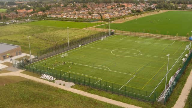Aerial view of Thirsk Falcons FC's football pitch, surrounded by green fields and residential areas.