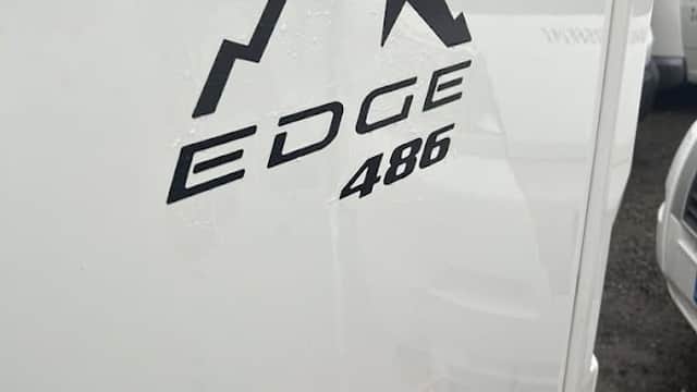 Logo featuring mountain peaks with "EDGE 486" in bold text on a white motorhome.