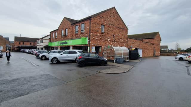 Co-op Food storefront in Haxby, Yorkshire, with parked cars and a cloudy sky overhead.