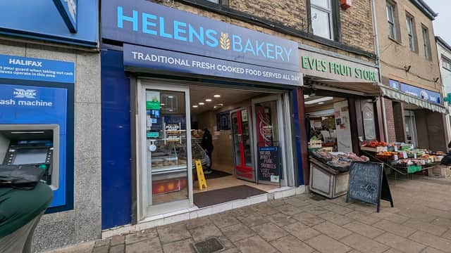Helens Bakery storefront with blue signage, fresh food display, and a nearby fruit store in Sheffield, Yorkshire.