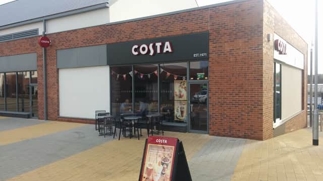 Costa Catterick Garrison storefront with large windows, outdoor seating, and a sign featuring the brand name.