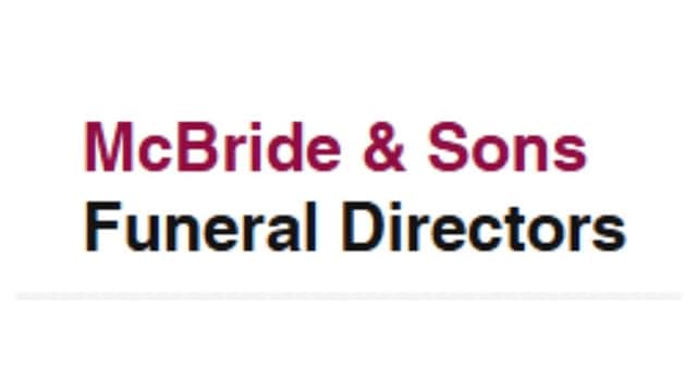 McBride & Sons Funeral Directors sign with a maroon and black text design.