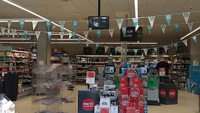 Welcome to Hailgate's Co-op; entrance with banners, shopping aisles, and promotional displays visible inside.