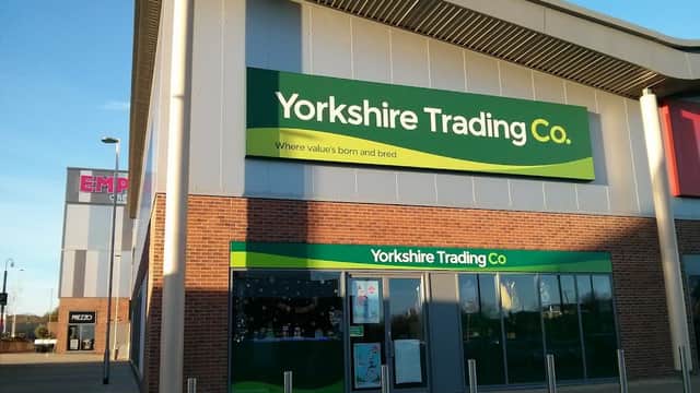 Yorkshire Trading Co. storefront with green signage, brick facade, and clear blue sky in Catterick Garrison.