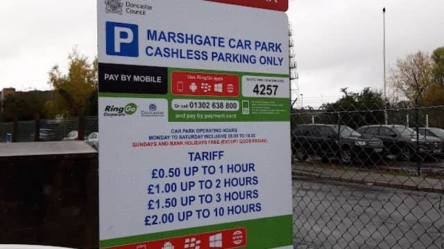 Sign for Marshgate Car Park in Doncaster detailing parking tariffs and disabled parking information.