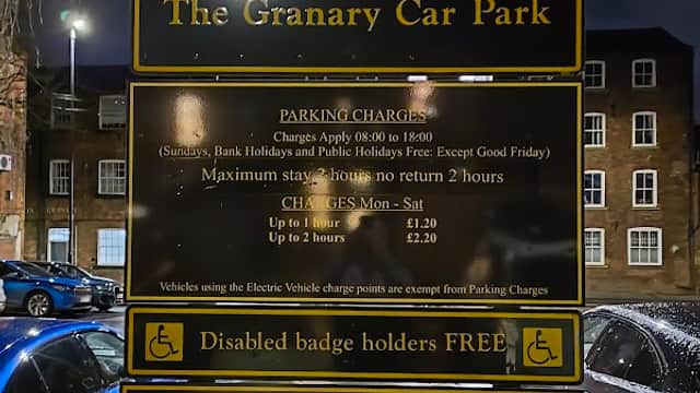 Welcome sign for The Granary Car Park, detailing parking charges, hours, and restrictions in Wakefield, Yorkshire.