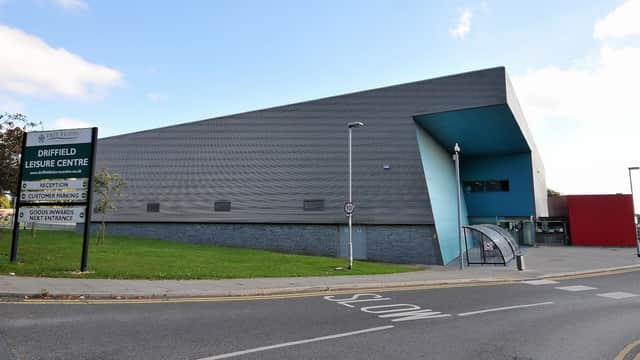 Modern leisure center with a sleek exterior, signage for Driffield Leisure Centre, and accessible entrance ramp.