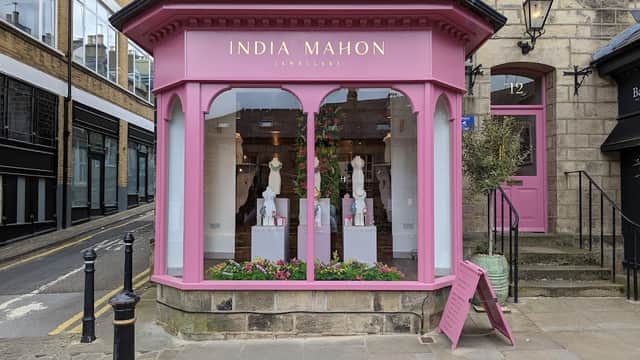 Charming pink storefront of India Mahon Jewellery with elegant displays and floral decorations in Harrogate, Yorkshire.