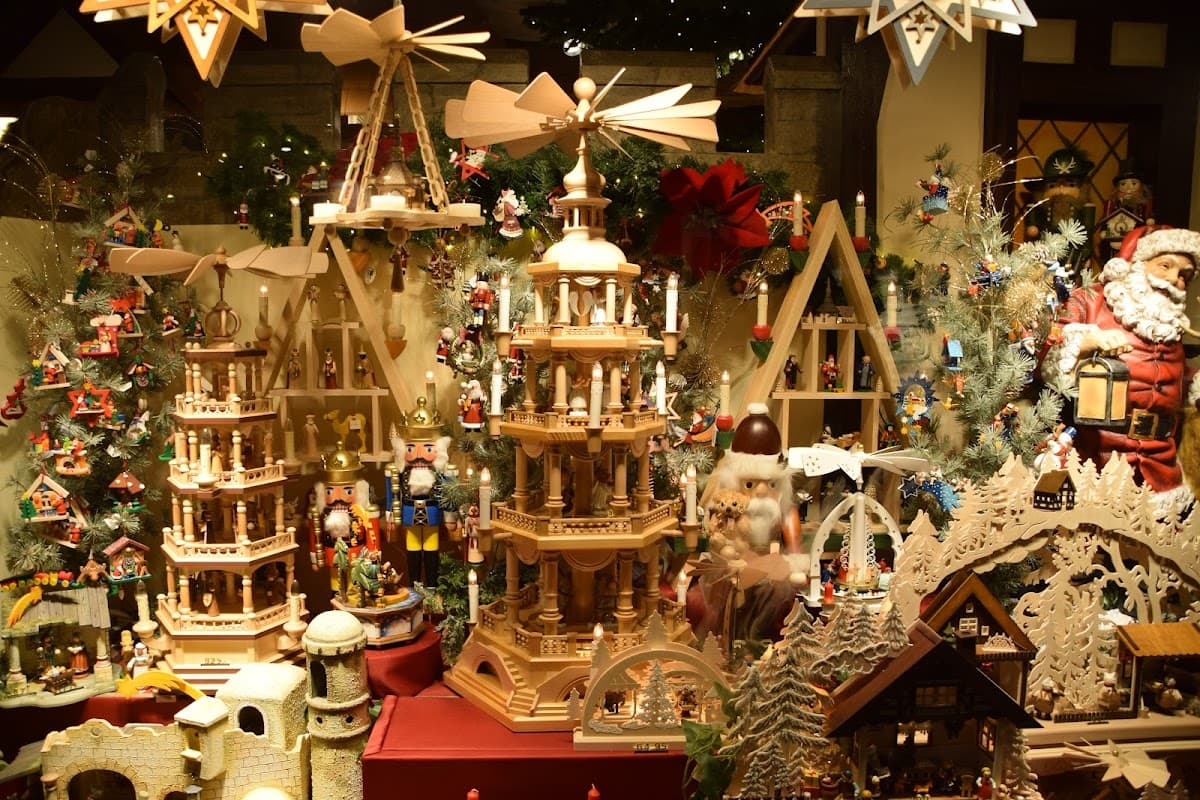 Festively decorated display with wooden toys, nutcrackers, and holiday ornaments in a cozy Bed & Breakfast setting.