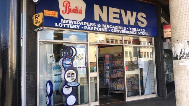 Bismillah News shopfront in Sheffield, featuring newspapers, magazines, and a convenience store entrance.
