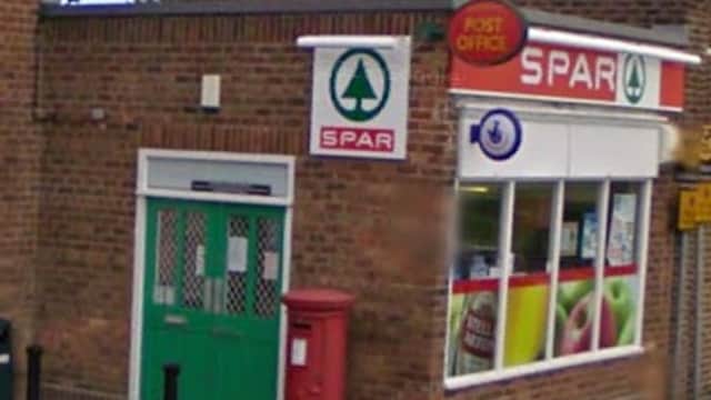 Spar shop with a red post box, green entrance, and large windows displaying products in Hutton Cranswick, Yorkshire.