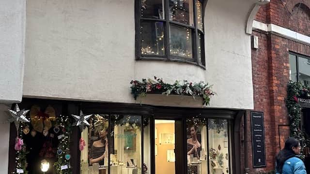 Charming gift shop with festive decorations, showcasing jewelry and a welcoming entrance in York, Yorkshire.
