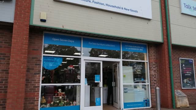 Sue Ryder storefront with a blue sign, showcasing furniture and household goods, and a welcoming entrance.