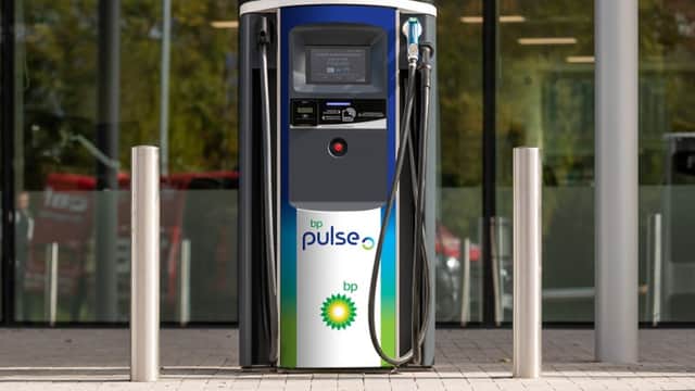 bp pulse electric vehicle charging station with a digital display, hoses, and BP branding, located in Penistone, Yorkshire.