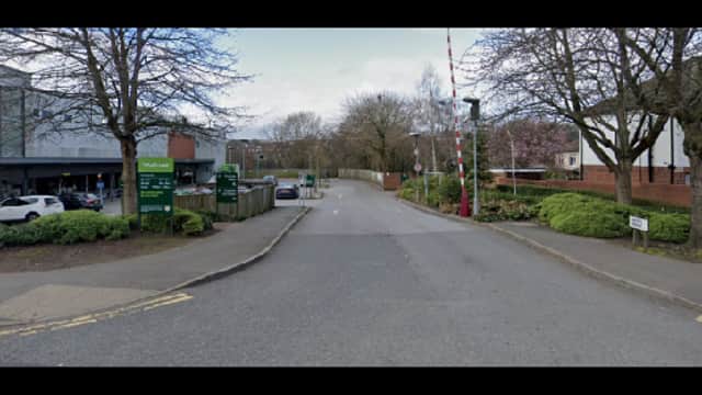 Pay & Display parking area in Meanwood, Yorkshire, with trees lining the road and signage visible.