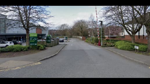 Pay & Display parking area in Meanwood, Yorkshire, with trees lining the road and signage visible.