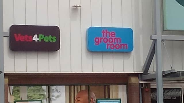 Signage for "Vets4Pets" and "the groom room" on a pet shop exterior in Bradford Idle, Yorkshire.