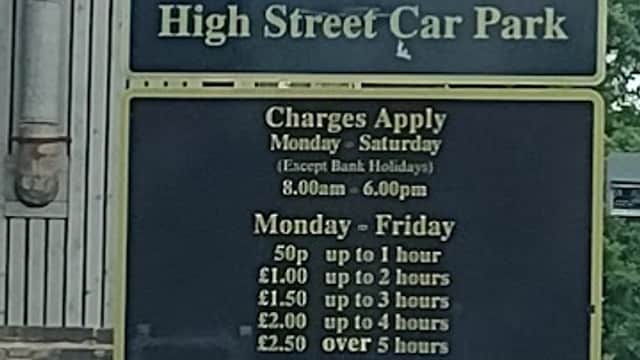 Sign for High Street Car Park in Exley, Yorkshire, detailing parking charges and conditions for different days.