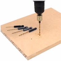 7-piece Trend Snappy hex drill set with black hex shanks and gold drill bits, drilling into wood.