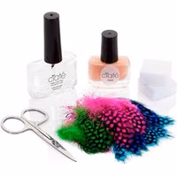 Ciaté Feathered Manicure Gift Box with clear polish, pink polish, colorful feathers, scissors, and white sponges.