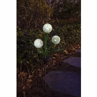 Solar Allium Bloom garden light with three glowing white spherical bulbs on green stems, set in a nighttime garden.