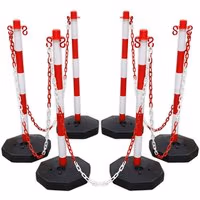 Red and white post and chain kit with six striped posts and black bases, connected by red and white chains.