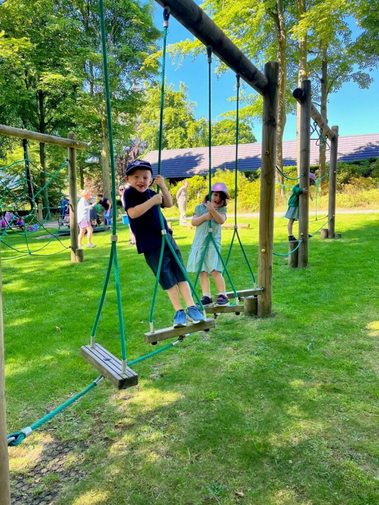 kids on swings in the park